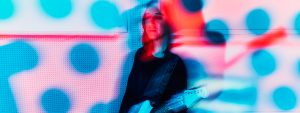 Jeff Schroeder blurred playing guitar